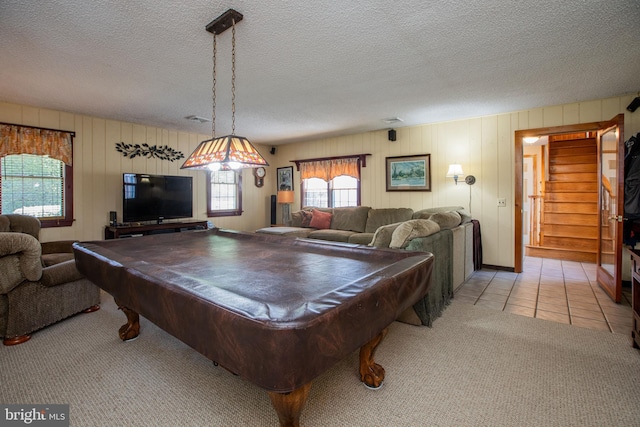 rec room with a textured ceiling, tile patterned floors, carpet, billiards, and visible vents