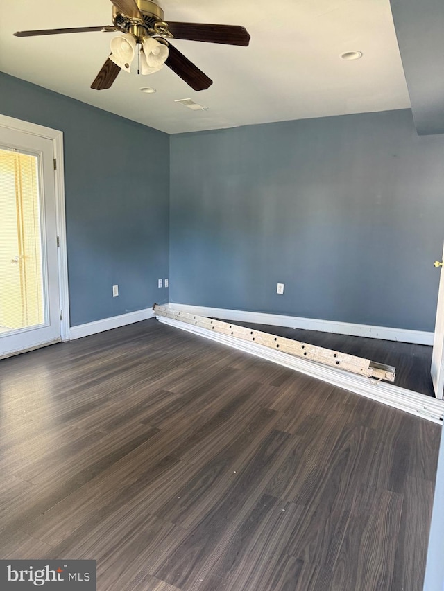 7601 Somerset Ln, Manassas, VA 20111 - spare room with baseboards, dark wood-type flooring, and a ceiling fan