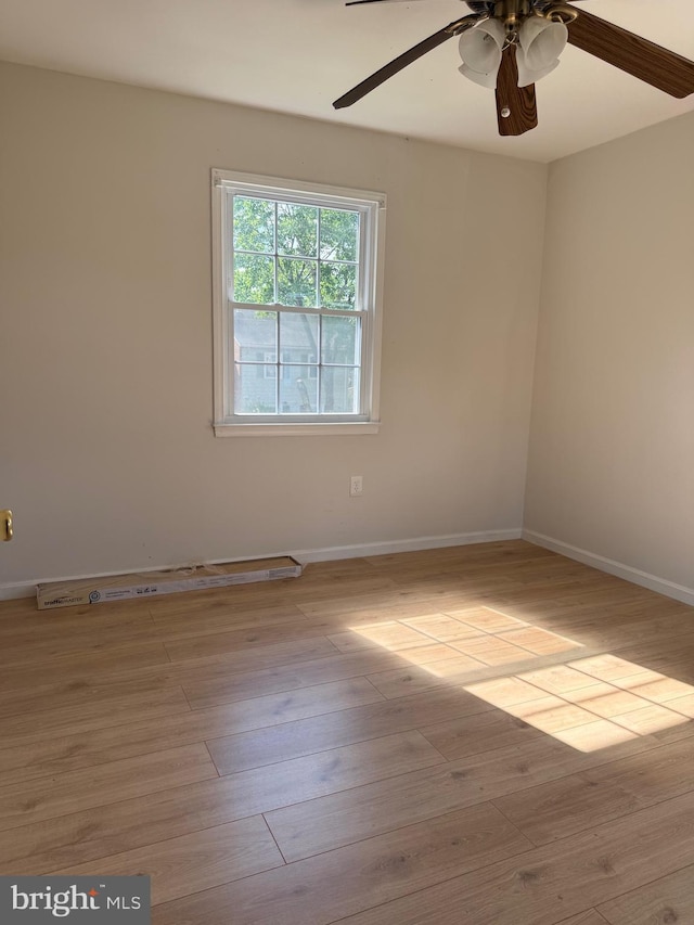 7601 Somerset Ln, Manassas, VA 20111 - spare room featuring a ceiling fan, wood finished floors, and baseboards