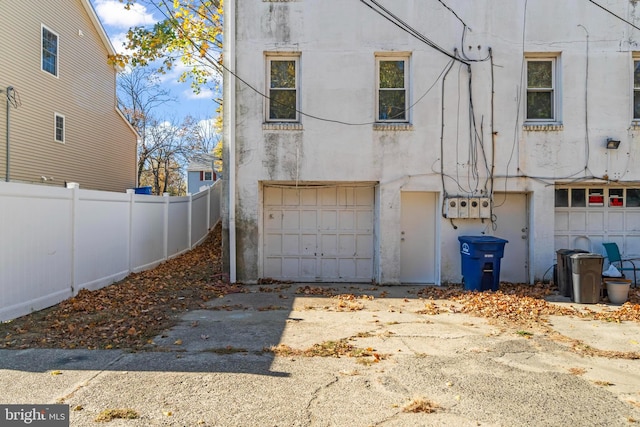 96 Budd Ave, Pemberton, NJ 08068 - view of front of home with aphalt driveway, stucco siding, fence, and an attached garage