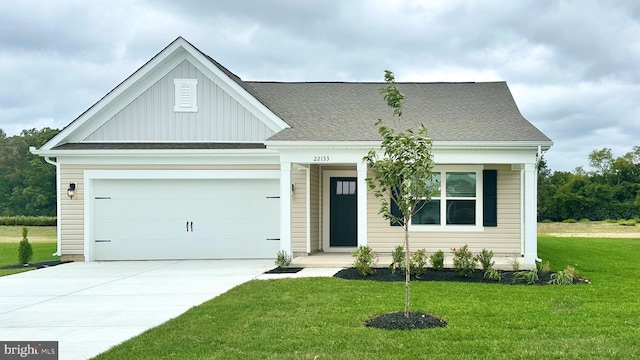 view of front facade featuring board and batten siding, a front lawn, an attached garage, a shingled roof, and driveway