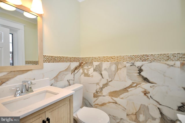 3532 Sheffield Ave, Philadelphia, PA 19136 - bathroom with tile walls, toilet, vanity, and wainscoting