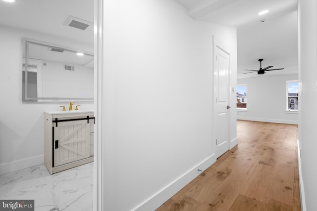 2049 E Letterly St, Philadelphia, PA 19125 - hallway featuring a barn door, visible vents, baseboards, and a sink