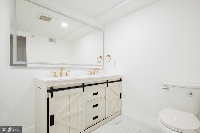 2049 E Letterly St, Philadelphia, PA 19125 - bathroom featuring baseboards, toilet, visible vents, marble finish floor, and a sink