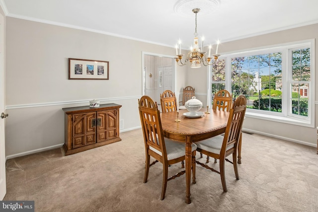 dining space featuring a healthy amount of sunlight, ornamental molding, light carpet, and a notable chandelier