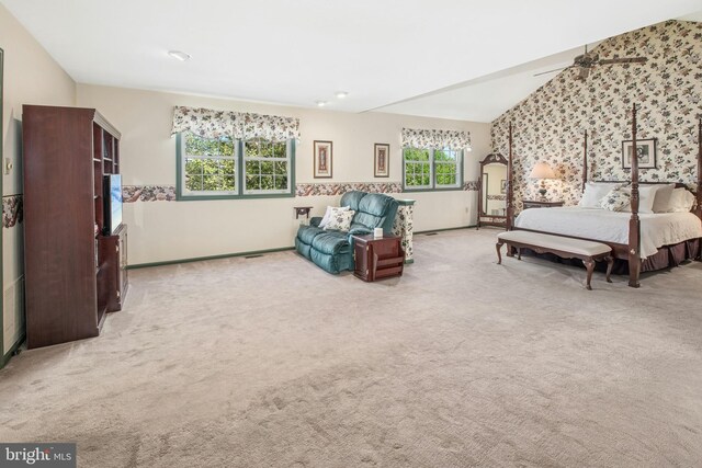 carpeted bedroom featuring wallpapered walls and baseboards