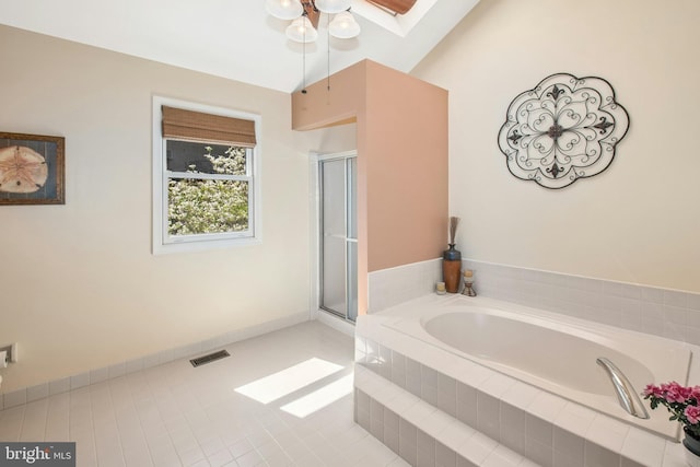 full bathroom featuring a shower stall, a bath, and visible vents