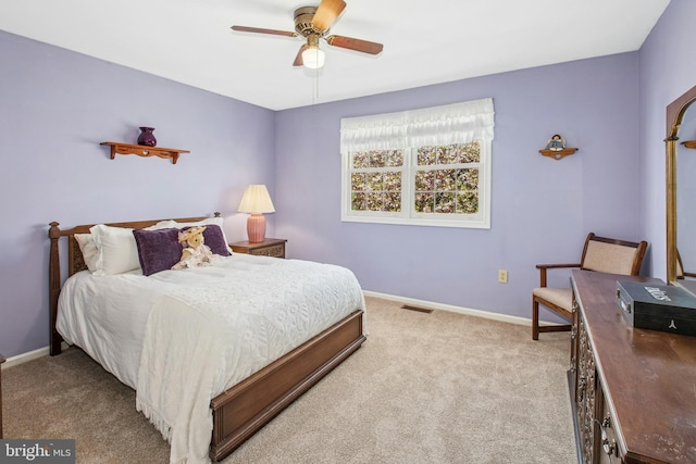 bedroom with carpet floors, a ceiling fan, baseboards, and visible vents