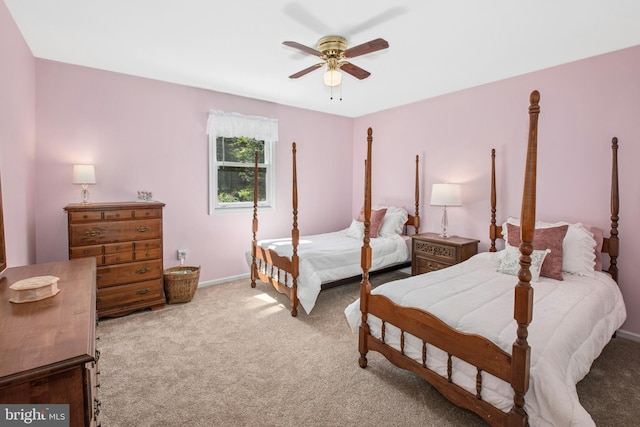 bedroom featuring carpet floors, baseboards, and a ceiling fan