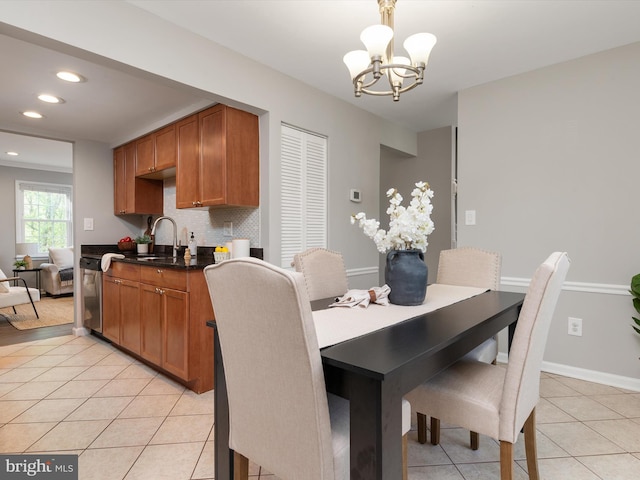 dining room featuring light tile patterned floors, recessed lighting, an inviting chandelier, and baseboards