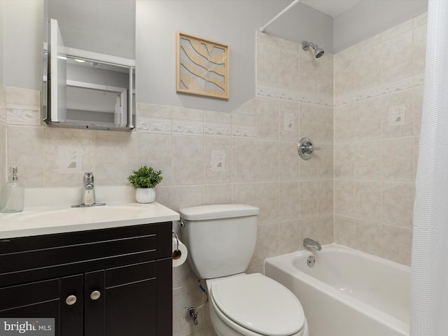 full bath with toilet, shower / bath combination with curtain, tile walls, and vanity