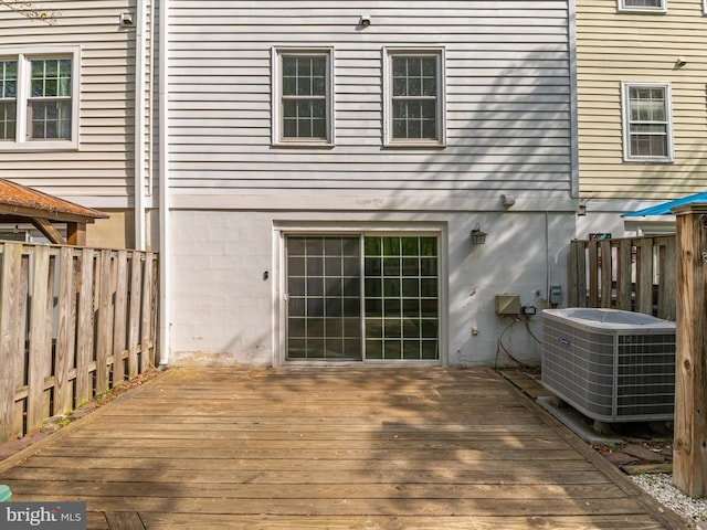 deck featuring fence and central AC unit