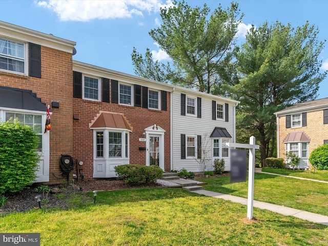 view of front of home with a front yard