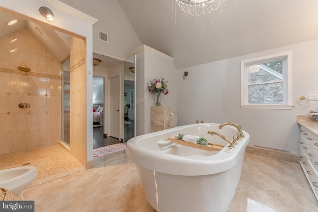 bathroom featuring lofted ceiling, a stall shower, a freestanding tub, tile patterned floors, and ensuite bathroom