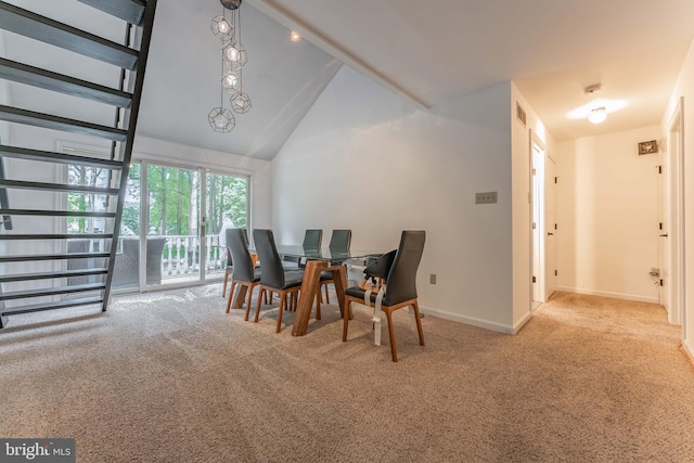 dining space with carpet floors, high vaulted ceiling, and baseboards