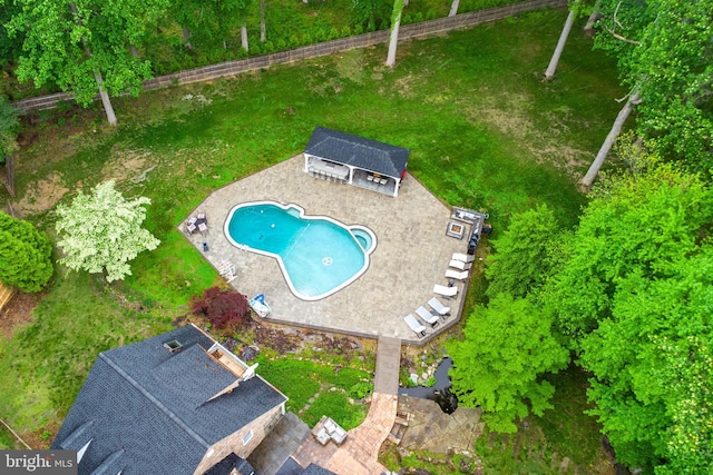 view of subject property with a pool area