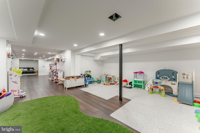 playroom with hardwood / wood-style flooring and recessed lighting