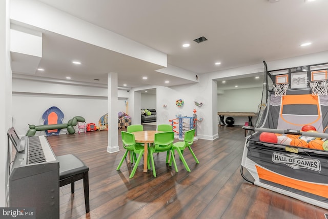 recreation room featuring wood finished floors, baseboards, and recessed lighting