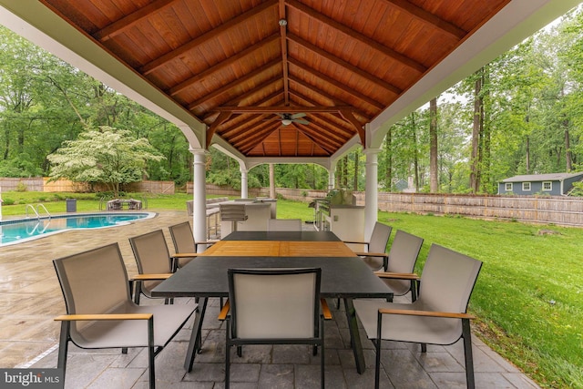 view of patio / terrace featuring a ceiling fan, a gazebo, and outdoor dining area