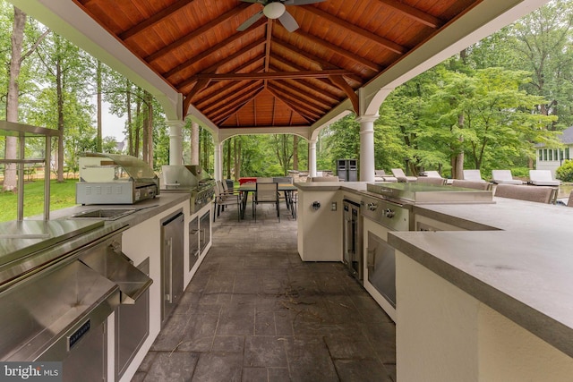 view of patio with area for grilling, a gazebo, grilling area, and ceiling fan