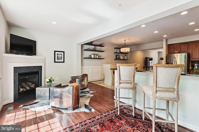 517 Deep Creek Vw, Annapolis, MD 21409 - living area with a fireplace with flush hearth, dark wood-style flooring, visible vents, and recessed lighting