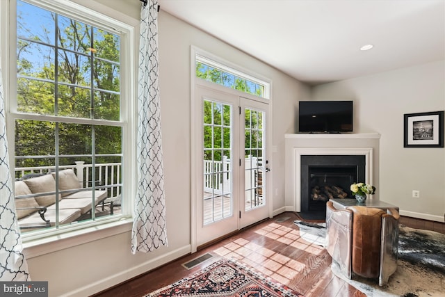 517 Deep Creek Vw, Annapolis, MD 21409 - interior space with visible vents, a fireplace with flush hearth, wood finished floors, and baseboards