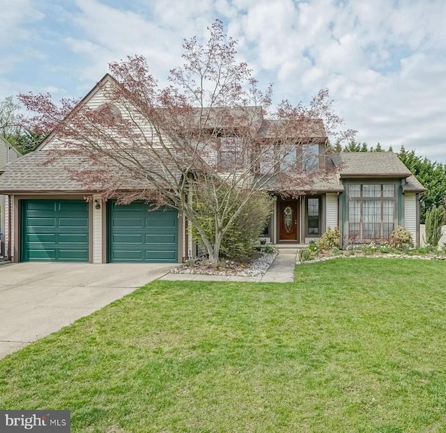 view of front of home with a front yard, driveway, an attached garage, and roof with shingles