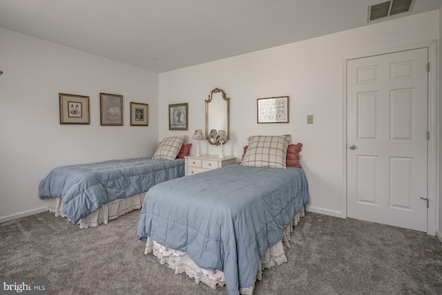 carpeted bedroom with visible vents and baseboards
