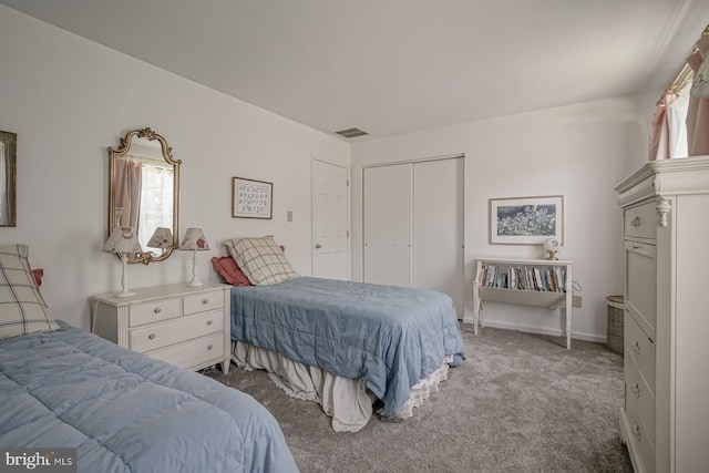 carpeted bedroom with visible vents, a closet, and multiple windows