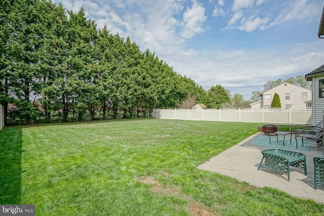 view of yard featuring fence and a patio