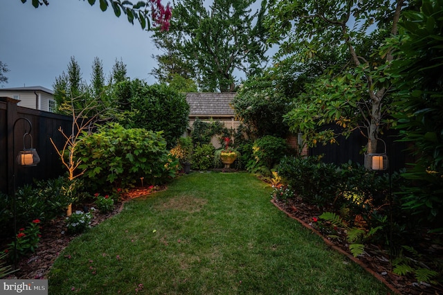 view of yard with a fenced backyard