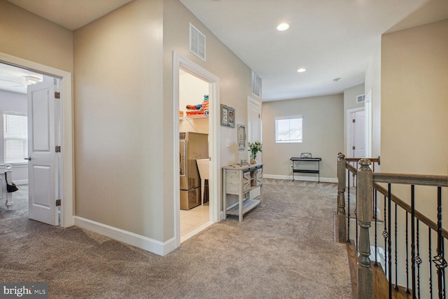 hall featuring recessed lighting, baseboards, visible vents, and carpet