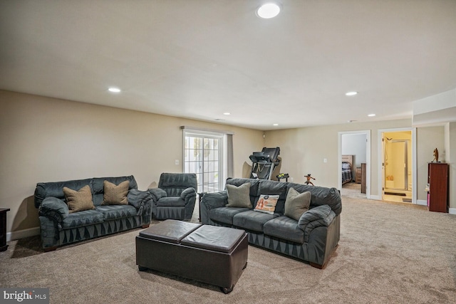 carpeted living room with recessed lighting
