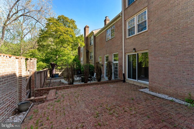 exterior space featuring a patio and fence