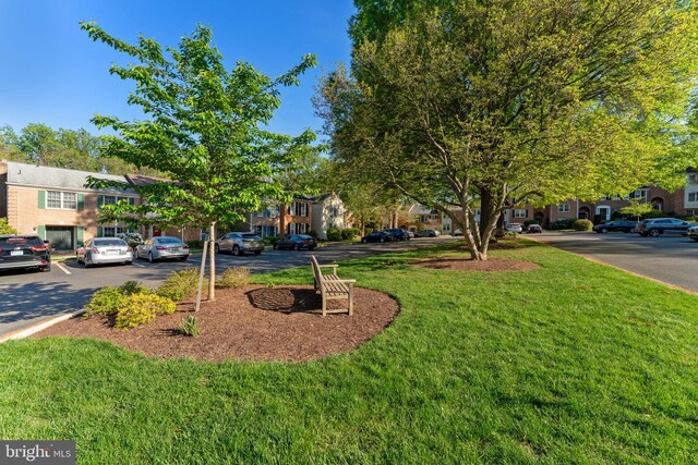 view of front of property with a residential view and a front yard