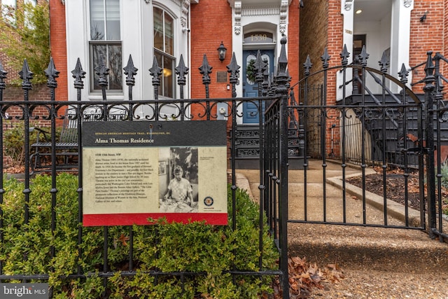 view of gate featuring a fenced front yard
