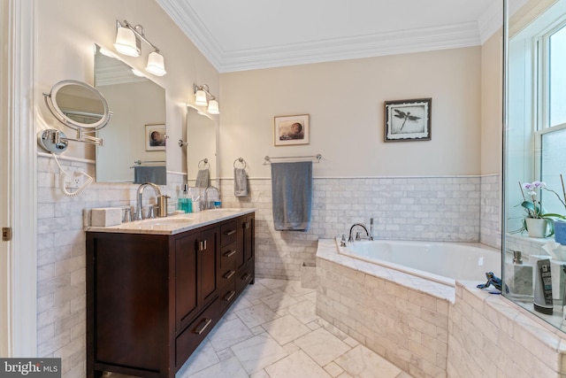 full bathroom with crown molding, a garden tub, vanity, marble finish floor, and tile walls