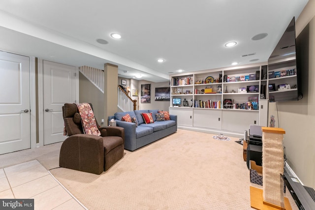 living room with recessed lighting, stairs, and carpet floors