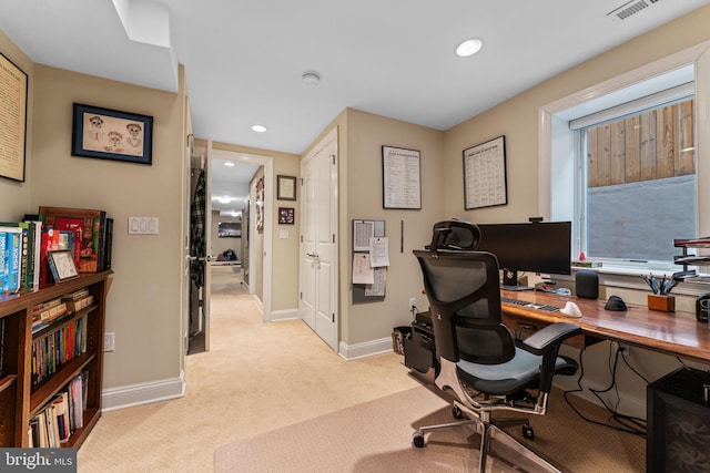 office space featuring visible vents, baseboards, recessed lighting, and light carpet