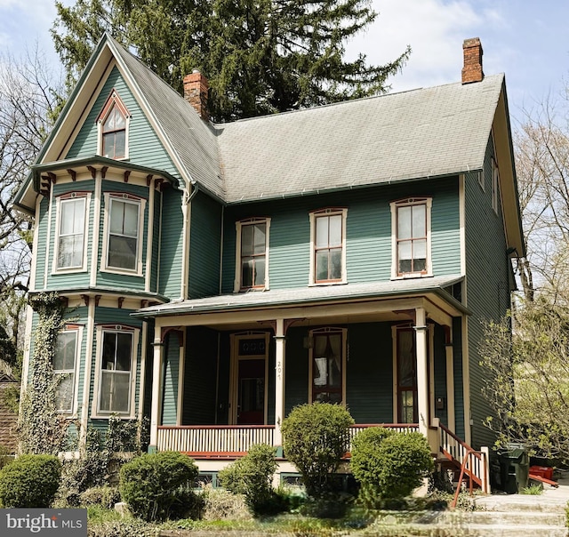 207 E Howard St, Bellefonte, PA 16823 - victorian-style house with a porch and a chimney