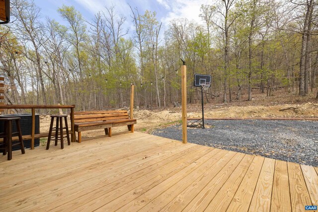 136 Wildwood Ln, Shenandoah, VA 22849 - wooden deck with central AC and a forest view