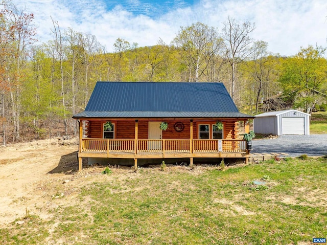 136 Wildwood Ln, Shenandoah, VA 22849 - log home featuring log siding, metal roof, an outbuilding, and covered porch