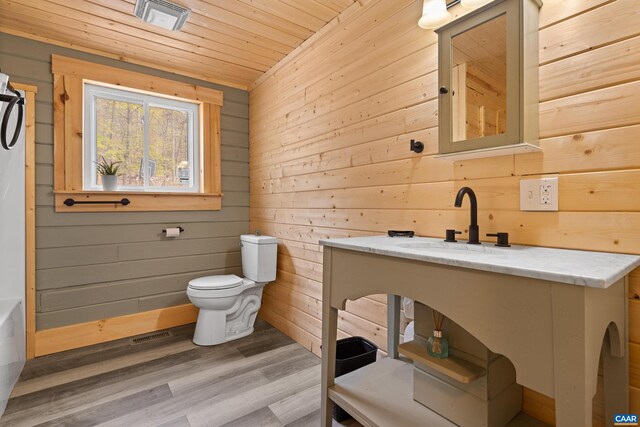 136 Wildwood Ln, Shenandoah, VA 22849 - full bath featuring wooden ceiling, toilet, wooden walls, a bathtub, and wood finished floors