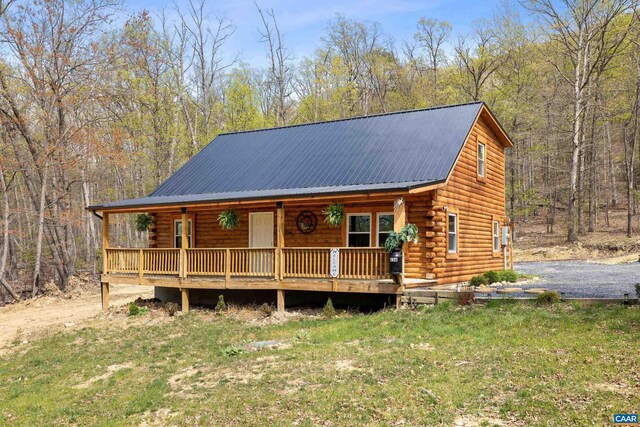 136 Wildwood Ln, Shenandoah, VA 22849 - log cabin featuring a porch, metal roof, and log siding