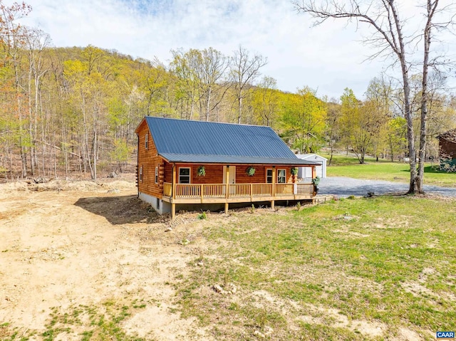 136 Wildwood Ln, Shenandoah, VA 22849 - exterior space featuring a wooded view, a yard, metal roof, and log siding