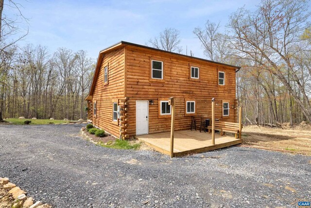 136 Wildwood Ln, Shenandoah, VA 22849 - rear view of house with a wooden deck and log exterior
