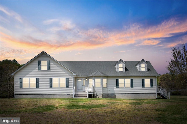 view of front of house featuring crawl space, a shingled roof, and a front lawn