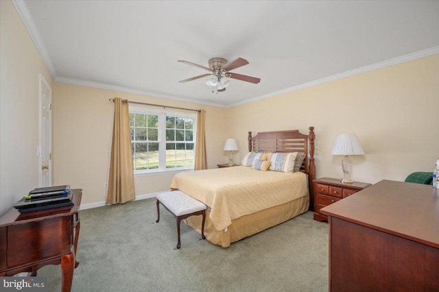 bedroom featuring ornamental molding, baseboards, ceiling fan, and light carpet