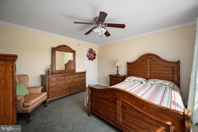 carpeted bedroom with crown molding, baseboards, and a ceiling fan