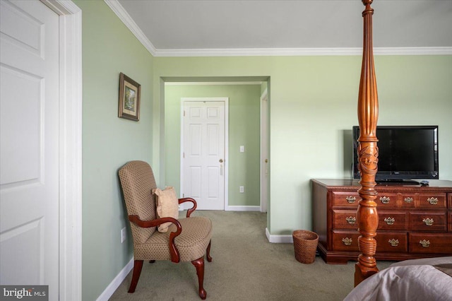 carpeted bedroom with baseboards and ornamental molding